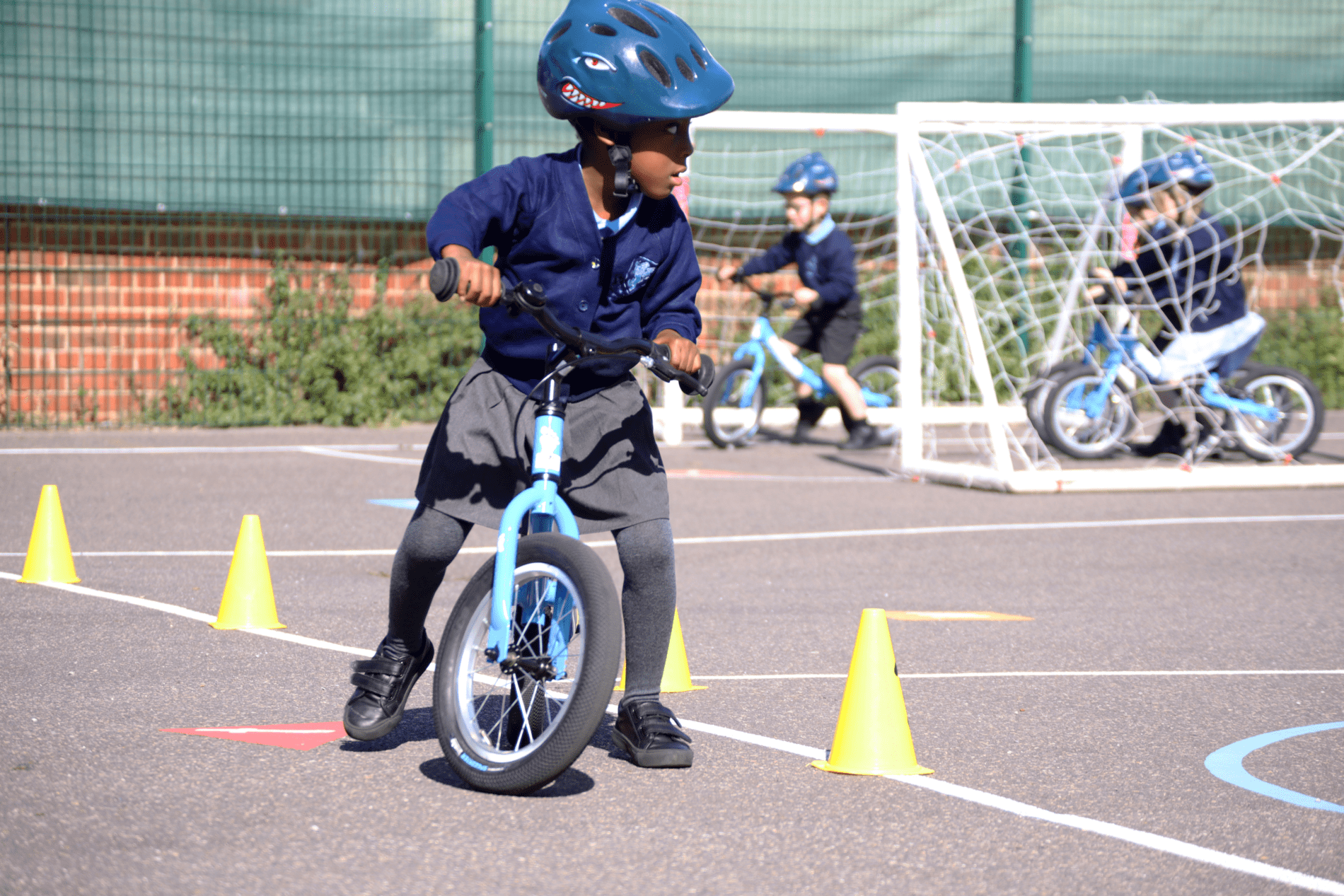 riding bikes in PE lesson at rosherville academy EYFS