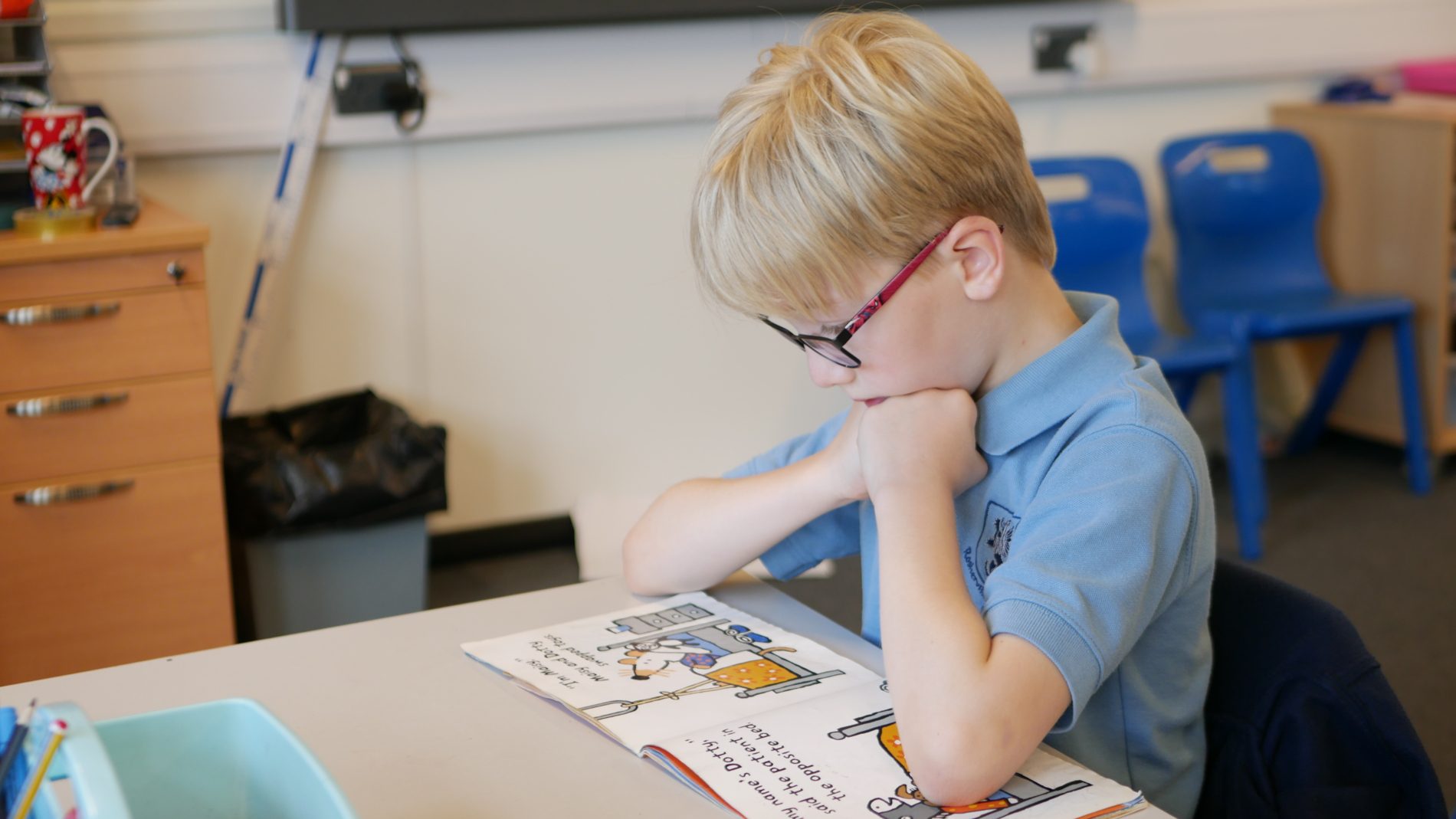 P1110683 pupil readin a book in KS2 at rosherville academy