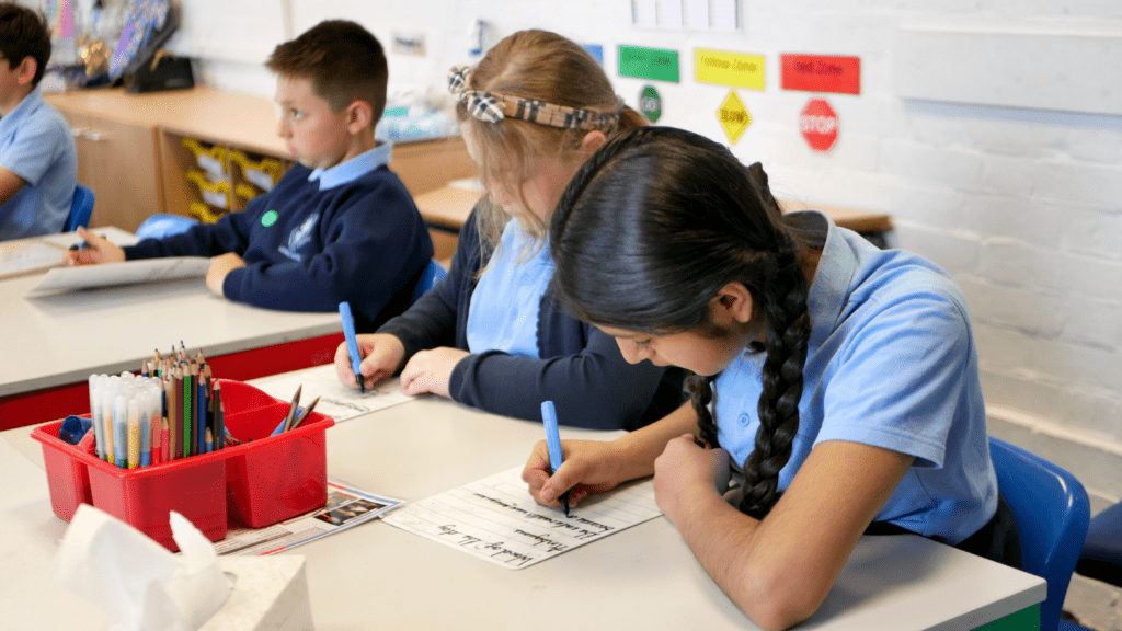 P1120154 pupils at rosherville academy primary writing in english class