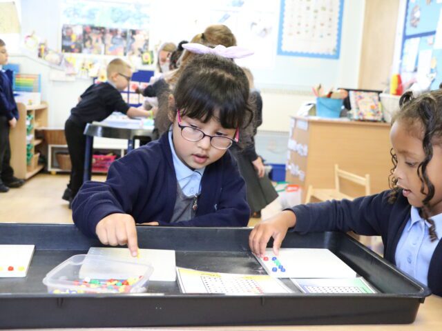 children at eyfs using counters for maths at rosherville cofe academy