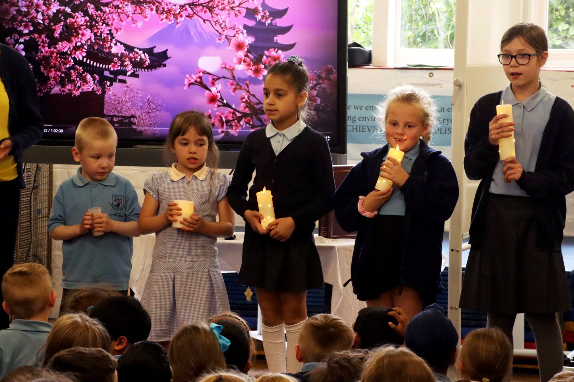 IMG_7827 group of children holding candles during worship at rosherville cofe academy