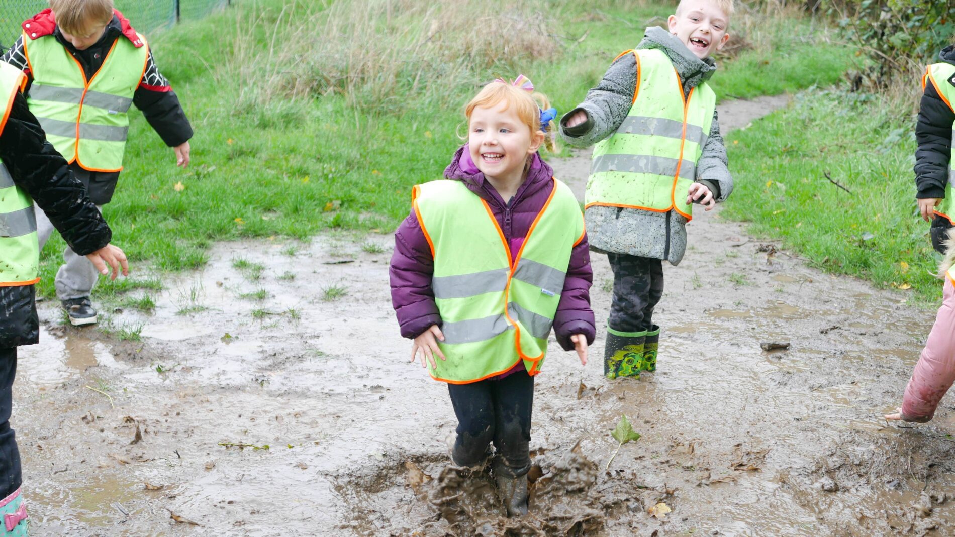 P1200737-min kids jumping in puddles during forest school at rosherville academy
