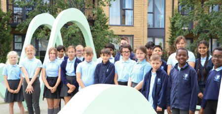 Gorup of Rosherville pupils inside light green metal art scultpure