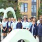 Gorup of Rosherville pupils inside light green metal art scultpure