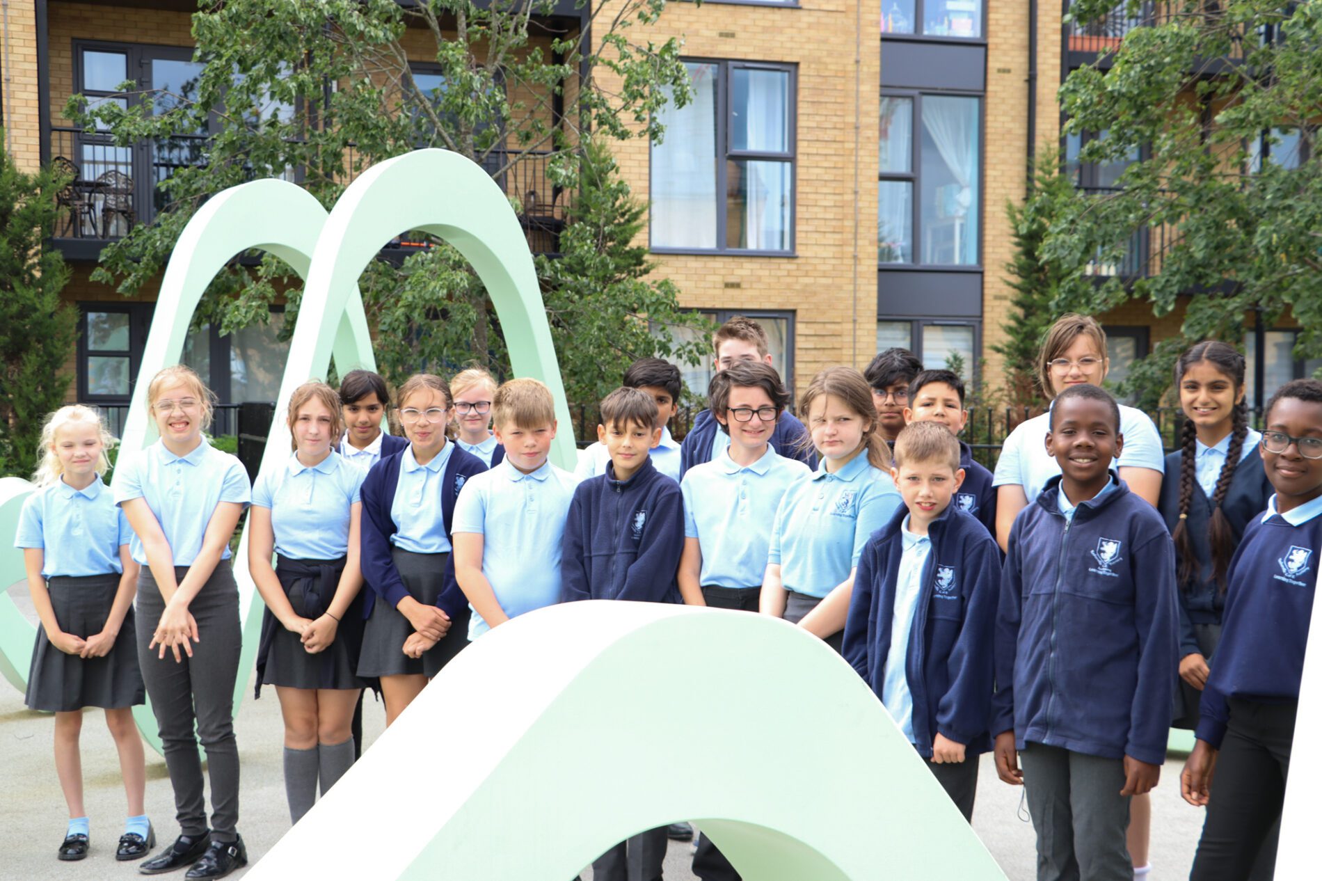 Gorup of Rosherville pupils inside light green metal art scultpure