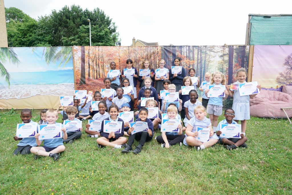 Group of pupils from every year group representing Rosherville at Darent Valley Hospital for the NHS 75th Birthday Artwork Competition.