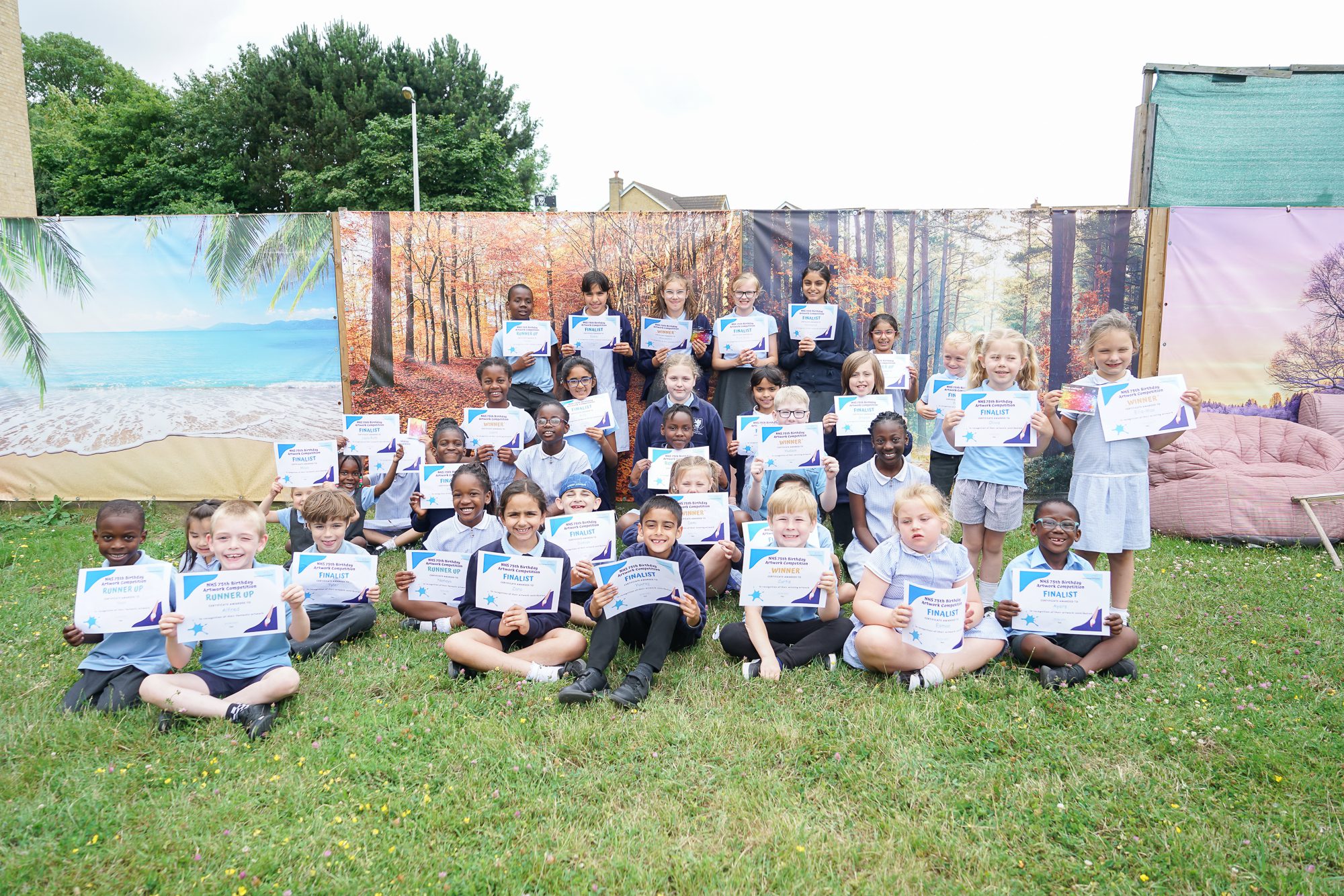 Group of pupils from every year group representing Rosherville at Darent Valley Hospital for the NHS 75th Birthday Artwork Competition.